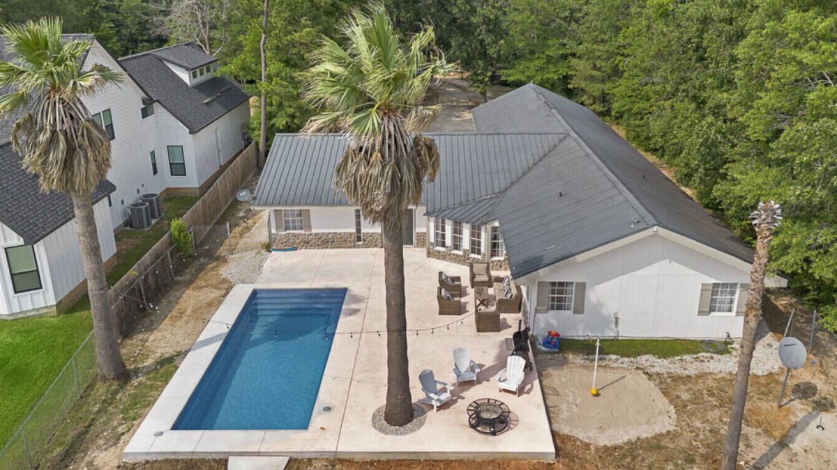 West Livingston House | Lakefront Retreat with Pool, Dock & Game Room