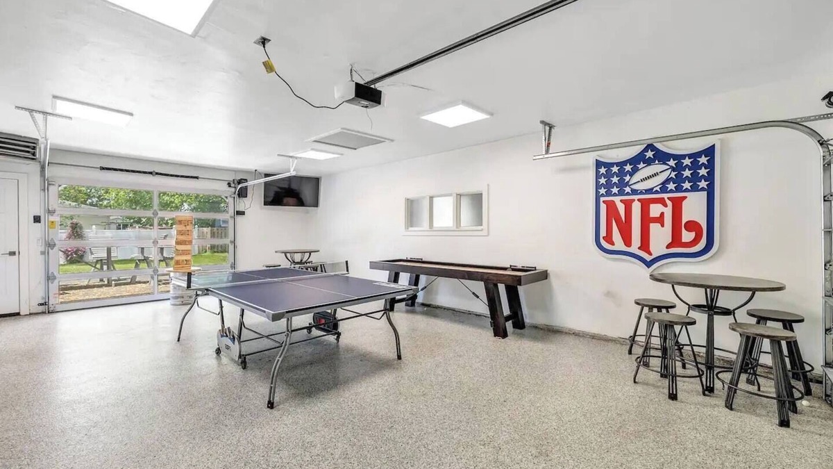 Ashwaubenon House | Lambeau Views + Tailgate Ready! Stay just steps from Lambeau Field with space for up to 12 guests! Enjoy a game-filled garage, hot tub, and backyard views of the stadium. Perfect for Packers games, weddings, family gatherings and group getaways.