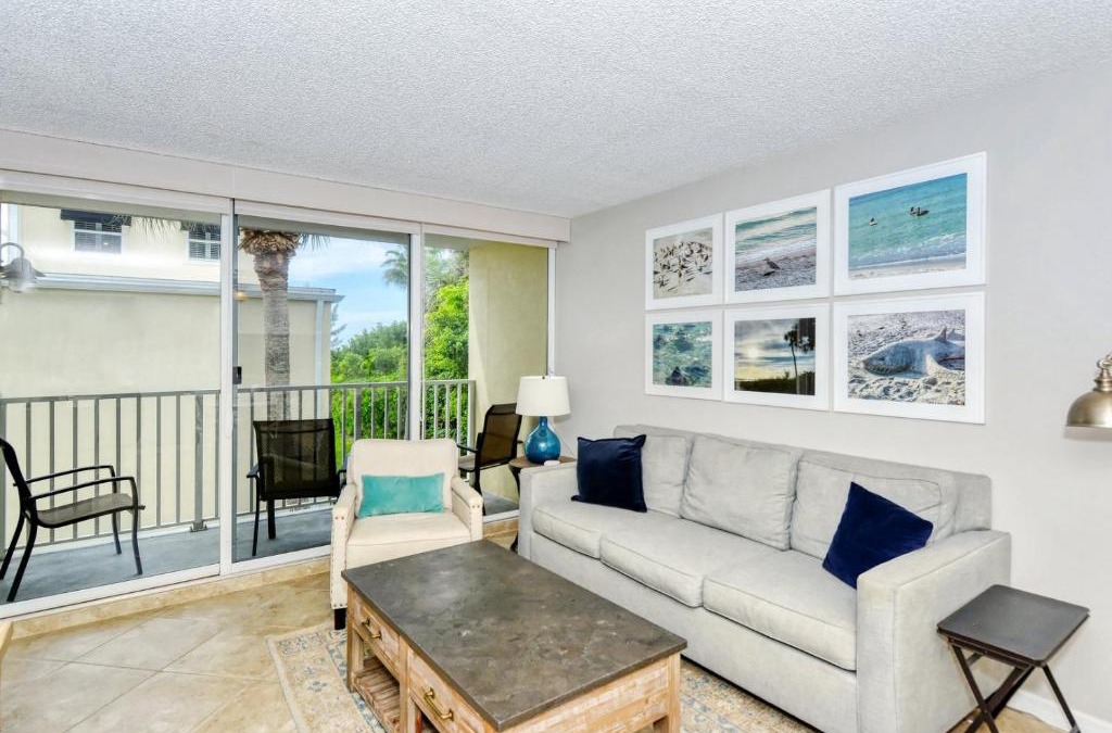 Longboat Key Apartment | LaPlaya 202E Catch the gentle Gulf breezes on your private balcony beneath the swaying palms