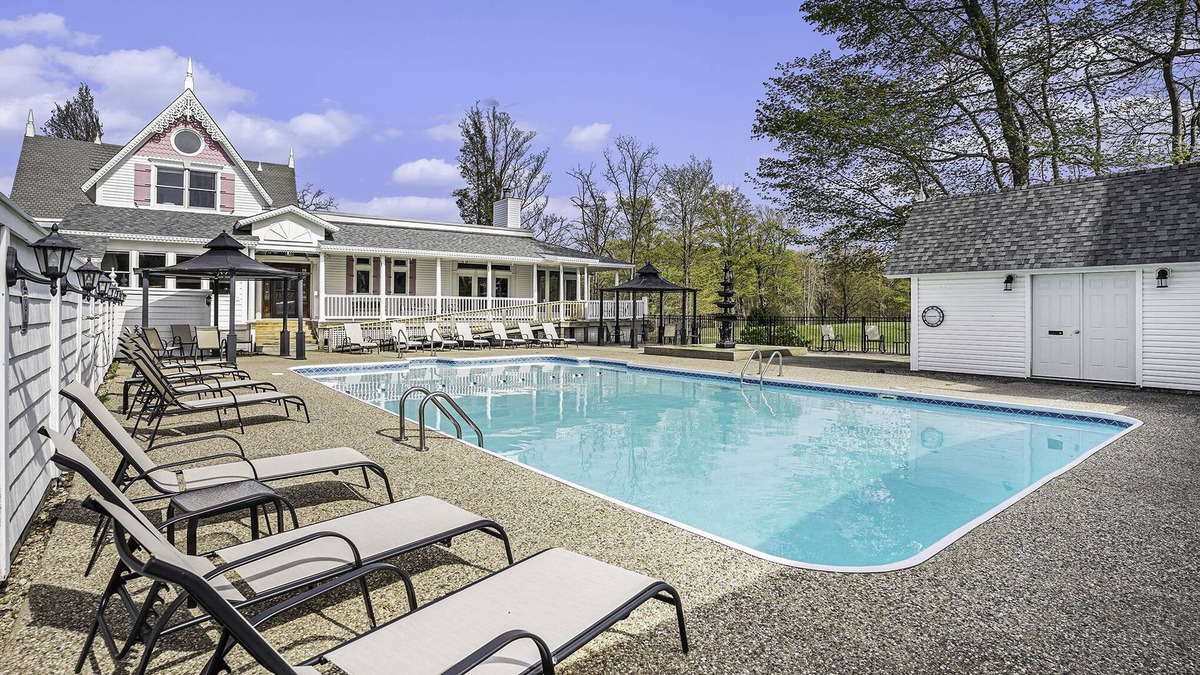 Fennville House | Large family friendly compound, heated pool, and Indoor Basketball court