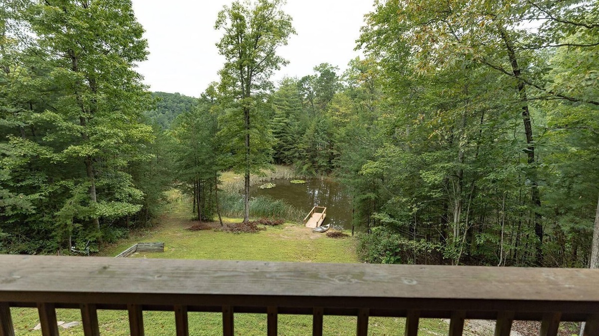 Zoe Cabin | Large Log home, private pond with dock, canoe, pool table, hot tub & internet.