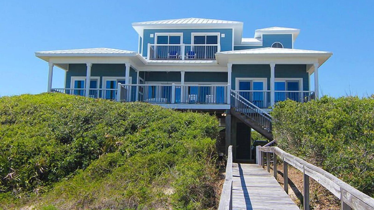 Sea Palm Village House | LEAVE YOUR WORRIES SURFSIDE. Take the private boardwalk and you're only steps from the beach.