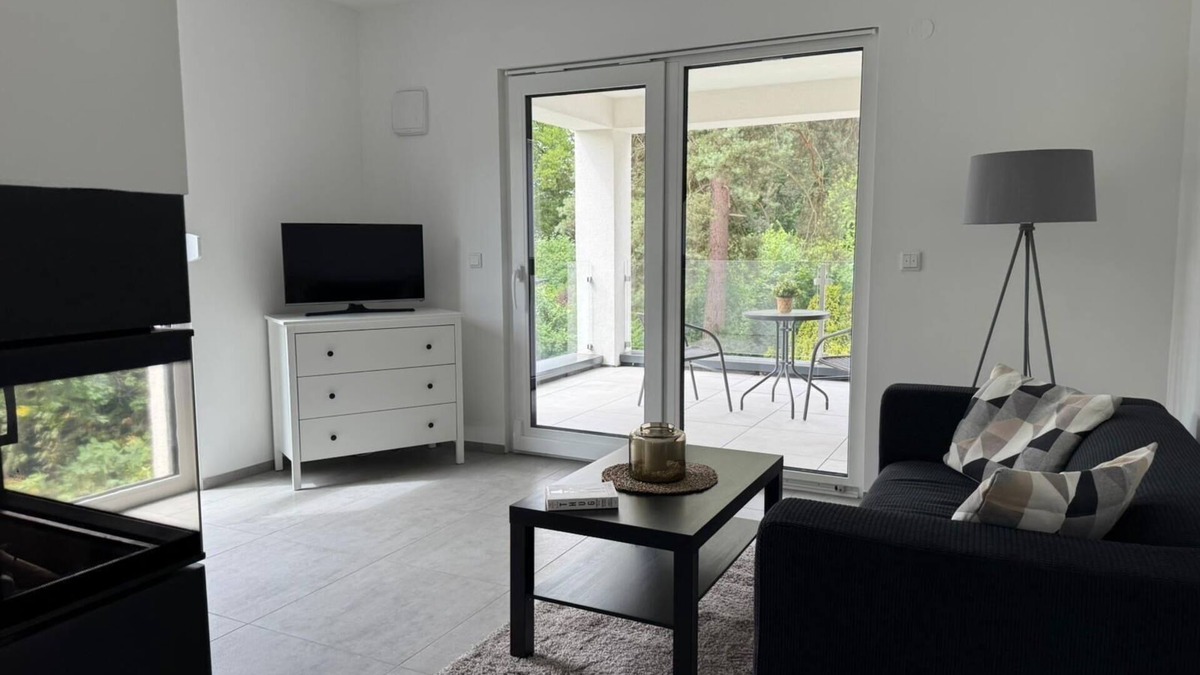 Trachenberge Apartment | Living Apartment mit Kamin und Terrasse