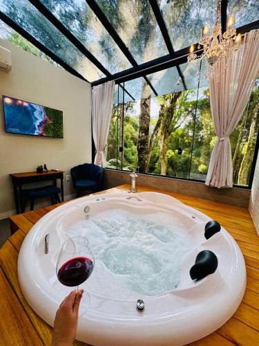 Carniel House | Loft com Hidromassagem