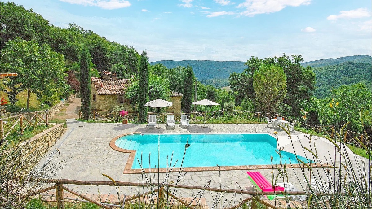 Ortignano Raggiolo House | Look forward to a fantastic view of the countryside on vacation in this appealing vacation home with