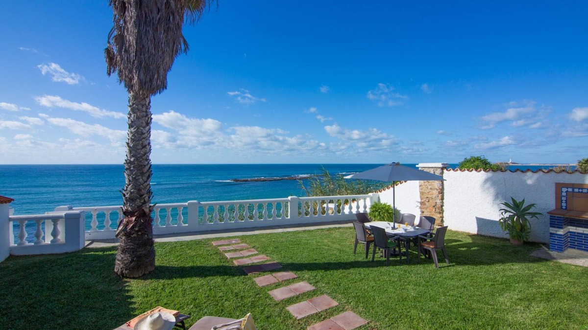 Los Canos de Meca Villa | Los Canos De Meca: Wonderful Villa located in front line beach, over a small cliff. Private garden and terrace with magnificent sea views. There is a private access to the beach below.