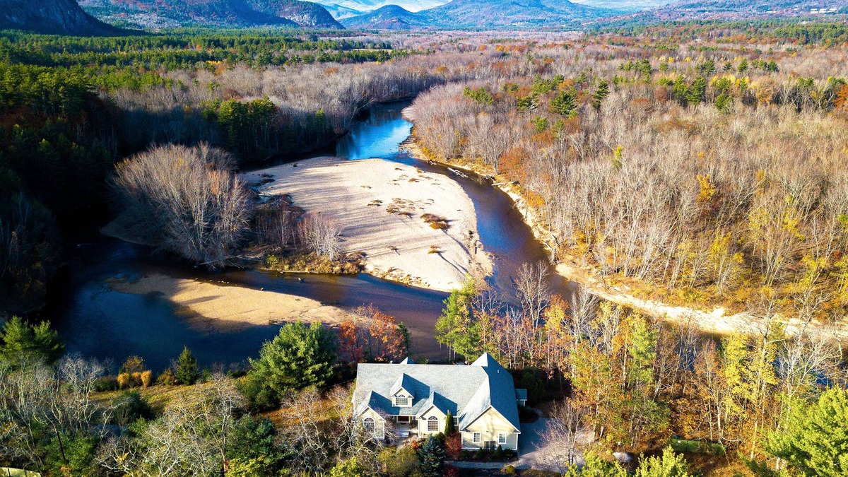 North Conway House | Lovely home with water view, hot tub, fireplace, & washer/dryer