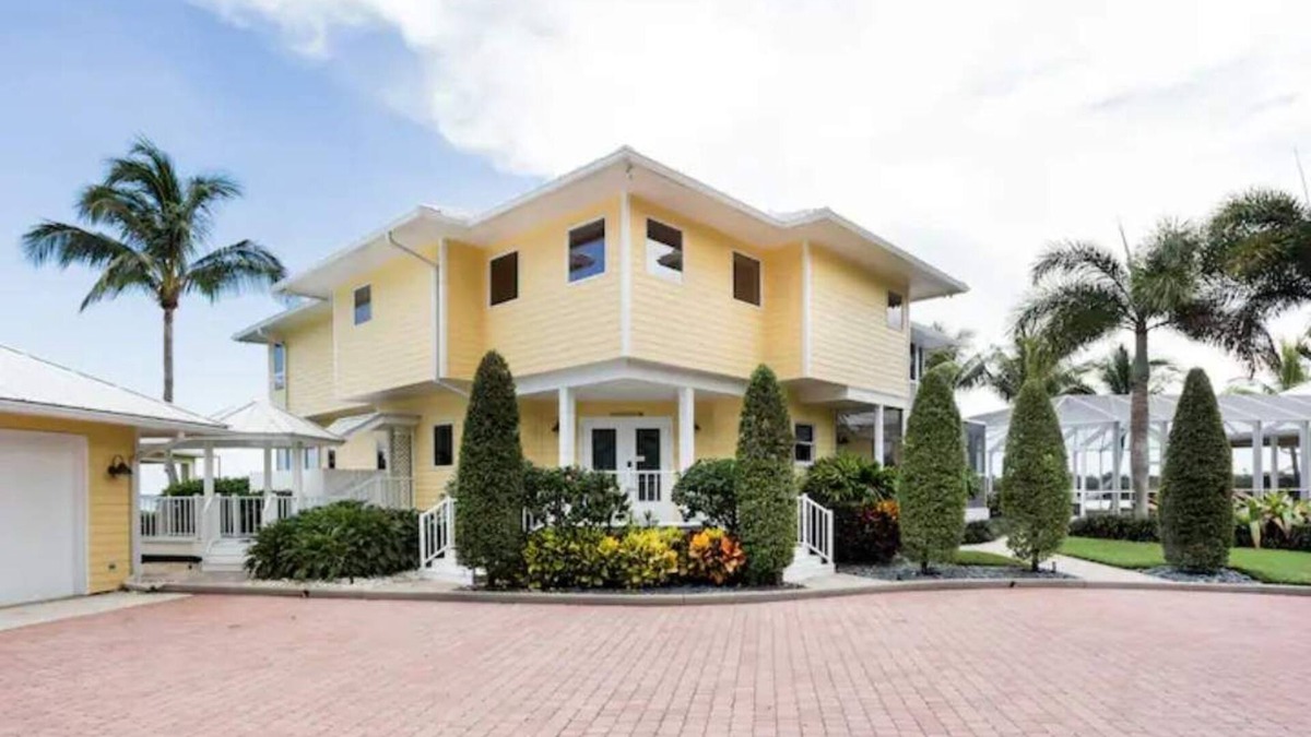 Palm City House | Lush Waterfront Pool Home and Pool house with Pickleball court and Boat dock