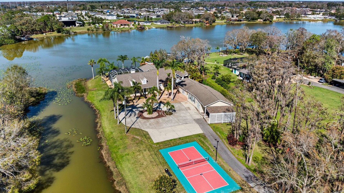 Westchase House | Luxe Waterfront Hideaway w Pool & Pirate Ship Dock