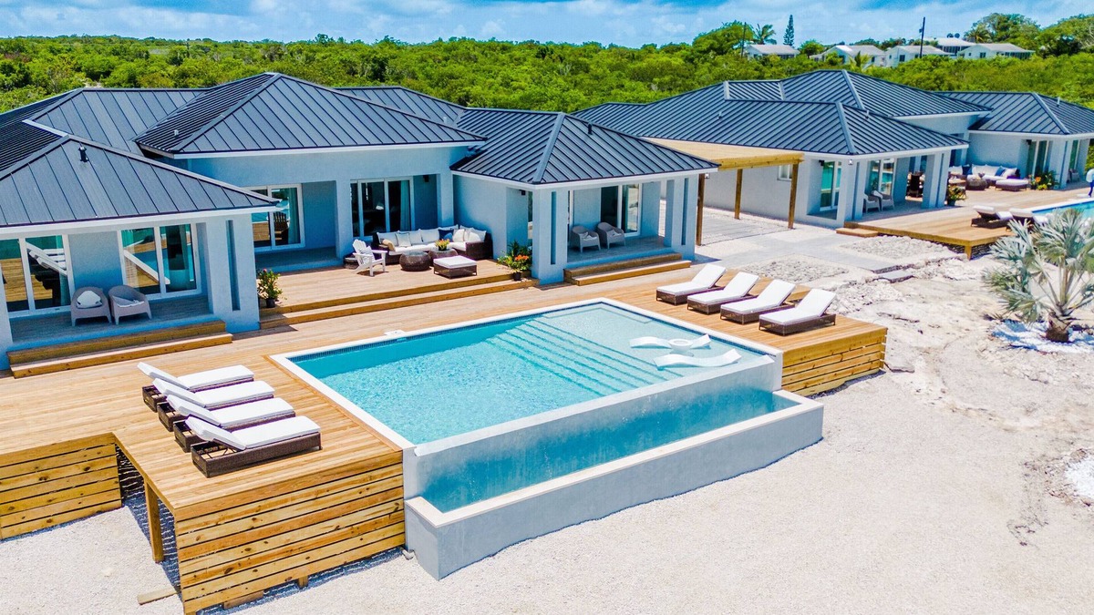 Hartswell Villa | Luxury beachfront villa with dock and a private large heated pool. For 10 people