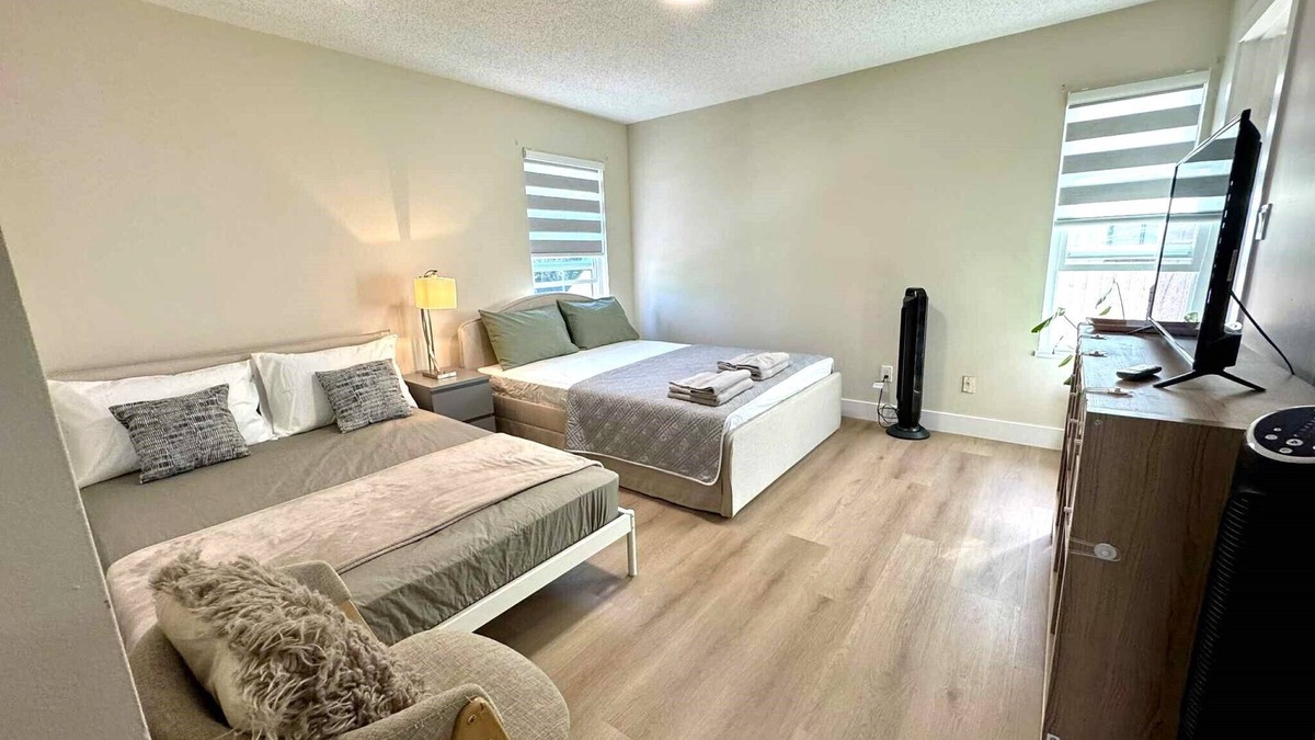 Surrey House | Master bedroom with private bathroom in British Columbia, Canada