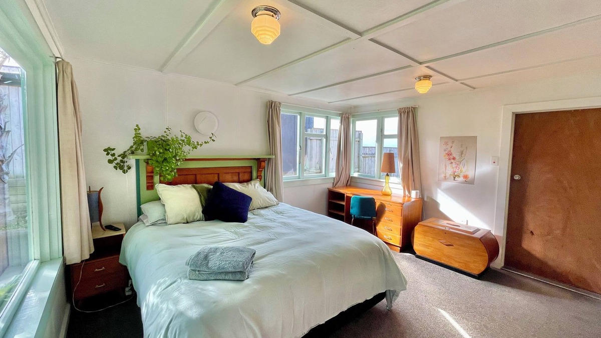 Castlecliff House | Mid-Century Beach Front Bach with beach access 2 doors down and superb views