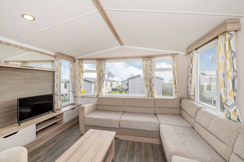 Otterton House | Modern and spacious 12ft-wide caravan with one double and two twin.