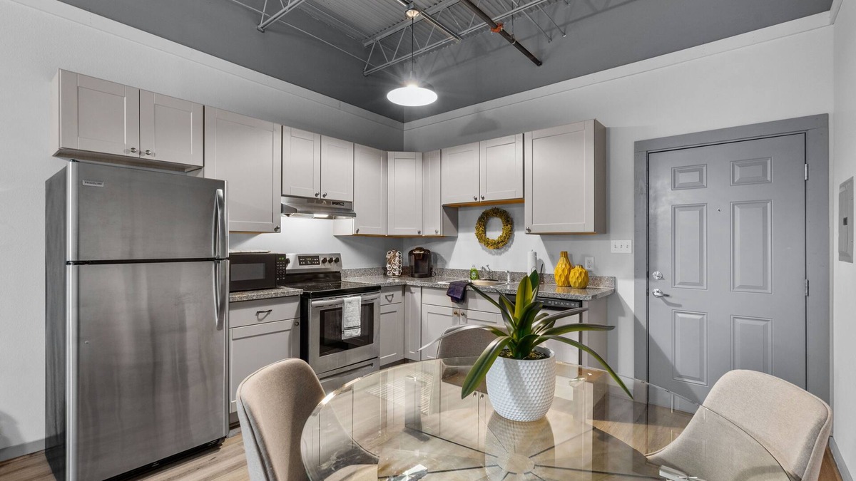 Baytown Apartment | Modern Loft Vibes Exposed Brick + Cozy Design