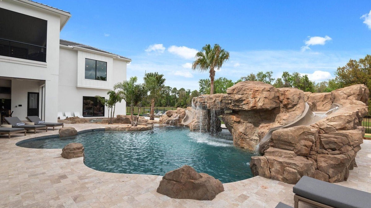 Reunion House | Morlando Three floor rocket ship, luxurious interior, back yard oasis with pool