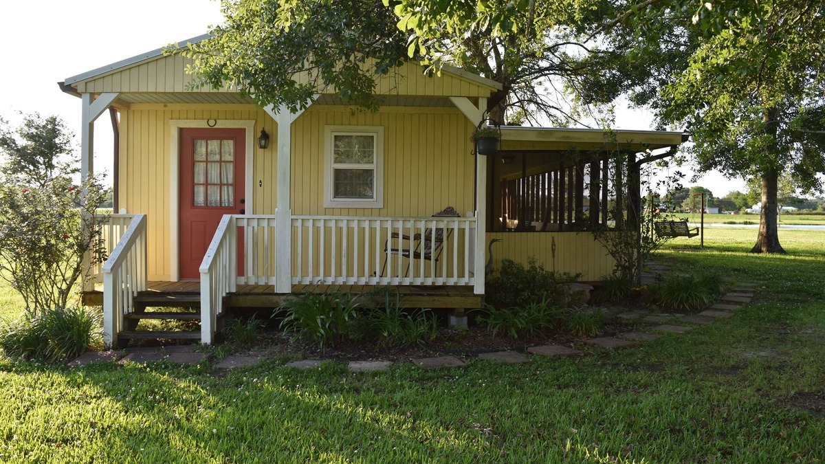 Breaux Bridge Cabin | "My Playhouse" Enjoy the country views from the wrap around screened porch