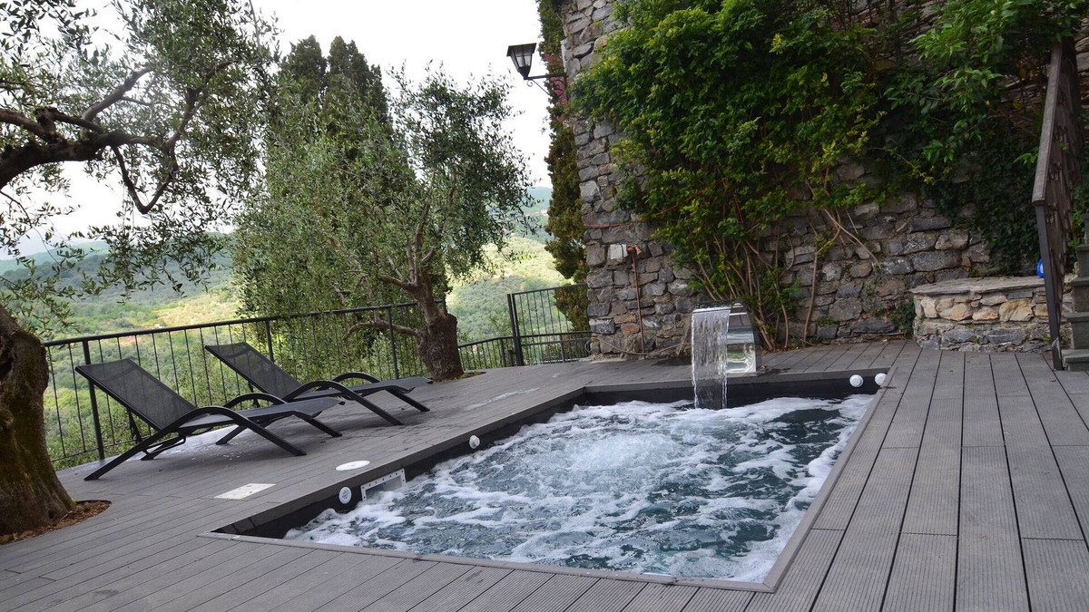 Praelo House | Natural stone house in panoramic position with pool and garden.