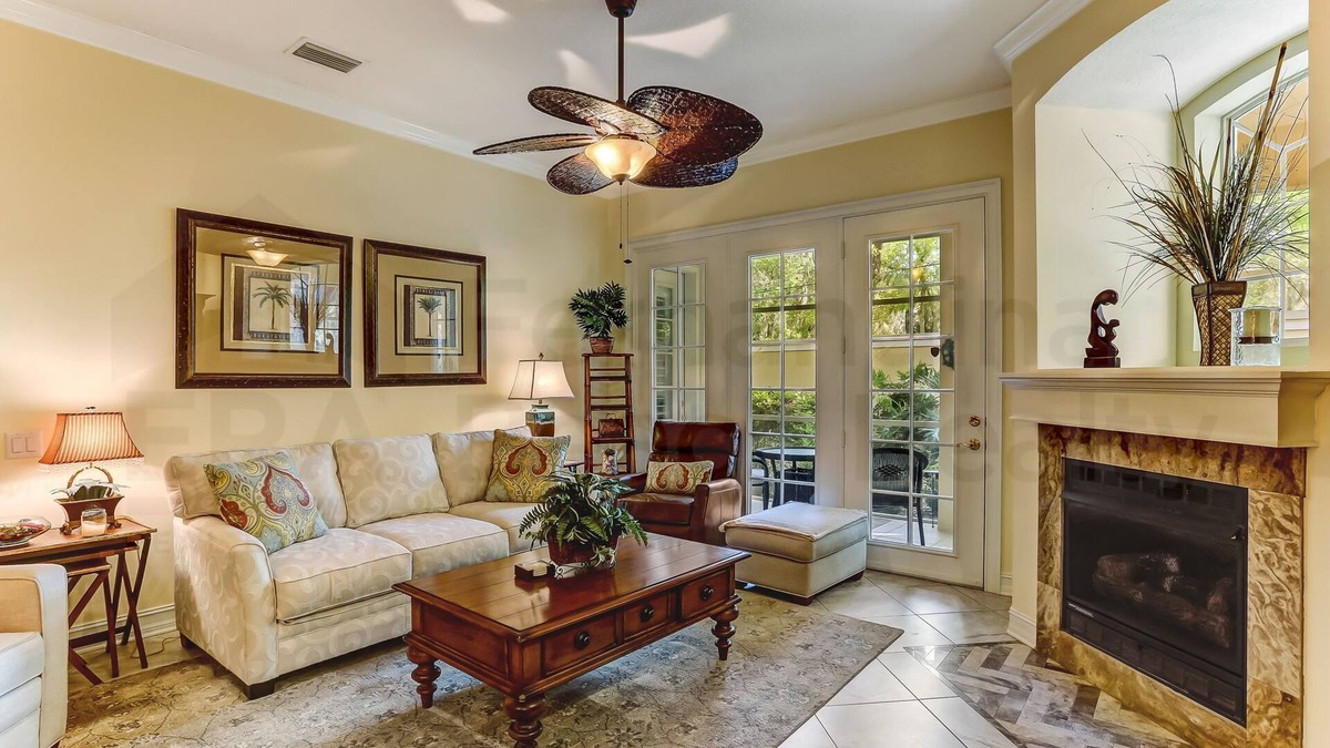 American Beach Condo | Nestled in a sancutary of beautiful trees in gated Villas at Summer Beach. Ground Floor unit.