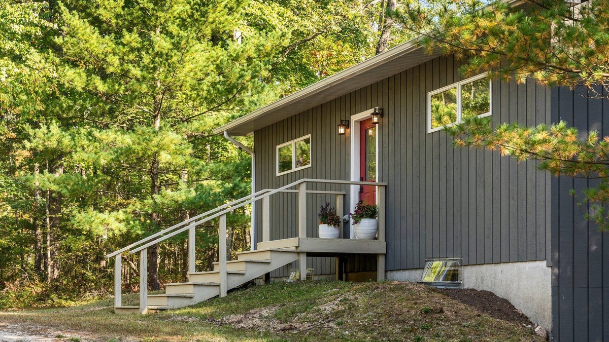 Big Rapids House | Nestled in the woods, this private detached Guest House is a perfect getaway!