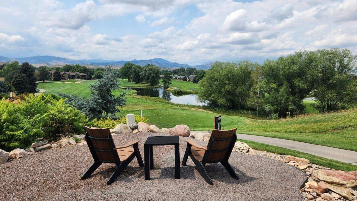 Loveland House | Nestled on the Marianna Butte Golf Course in Loveland, this modern garden-level basement retreat offers stunning mountain & lake views through large windows, flooding the space with light. Just a short drive to CSU campus & Estes Park