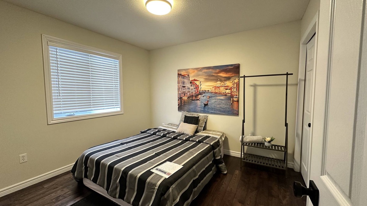 Grand River South House | Nice home with cozy living room, large backyard, bedroom and bathroom.