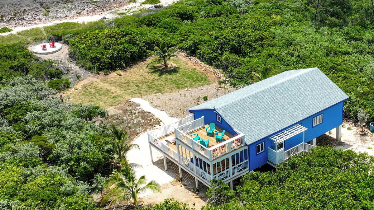 Dunmore Town Cottage | Oceanfront Cobalt Cottage- rooftop deck, generator, slide, & daybed swing!
