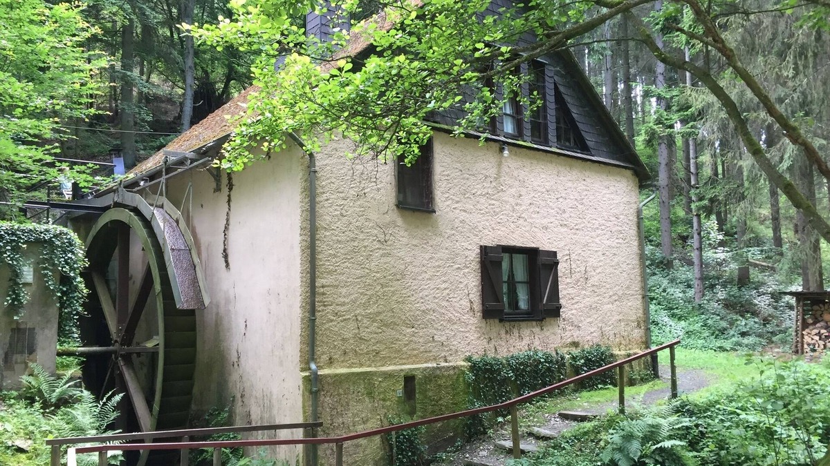 Fronhofen House | Old farm mill with a water wheel rebuilt as a vacation home