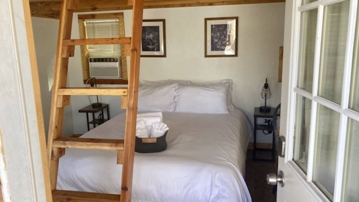 Montrose Cabin | One room camping cabin Double bed on the main level and two lofted twin-size beds Heating and cooling Sleeps: 4 Pets: 2 Parking: 1