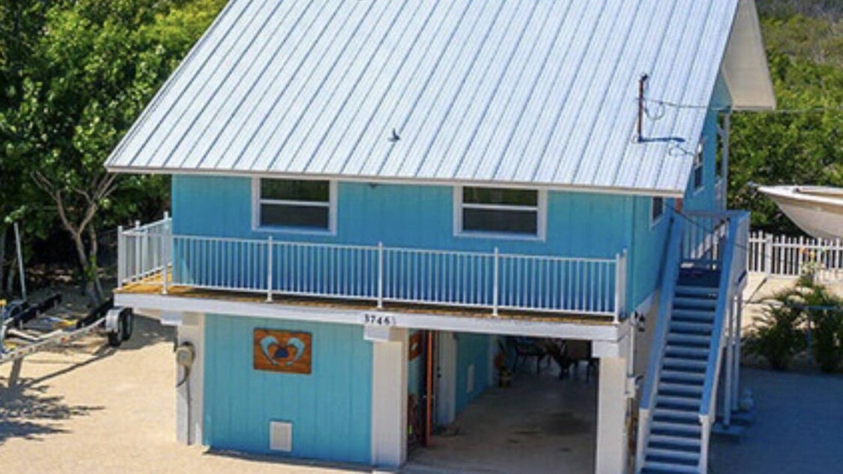 Port Pine Heights House | PADGETT PARADISE with Two Boat Slips with Filet Table. POOL