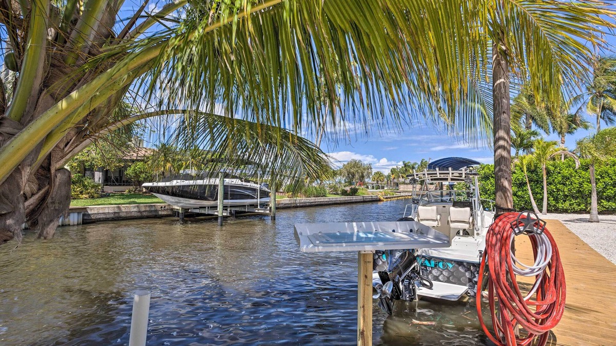 Palm City House | Palm City Canalfront Home w/Boat Dock & Fire Pit!