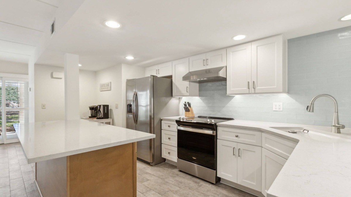 American Beach Condo | Pet Friendly | Ground Floor Sailmaker Villa | Covered Patio with Pool View