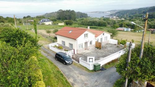 Ares House | Pozo das Leiras-izquierda-