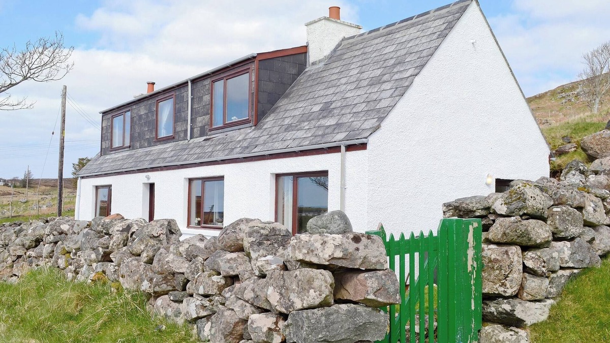 The Hebrides Cottage | Pretty whitewashed croft cottage perched on the hillside above the coastal village of Gairloch .