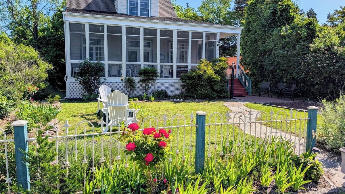 Cape May Point House | Pristine, Cozy, 4 bedroom Beach Cottage with a 40 foot screened in front porch!