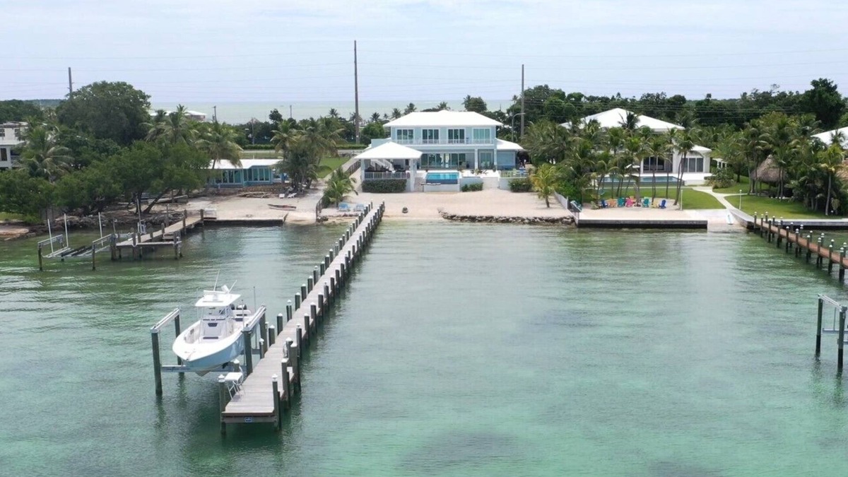 Key Largo House | Private Beach Bayside 6 Bedroom Resort Home with Pool, Dock, & Garage
