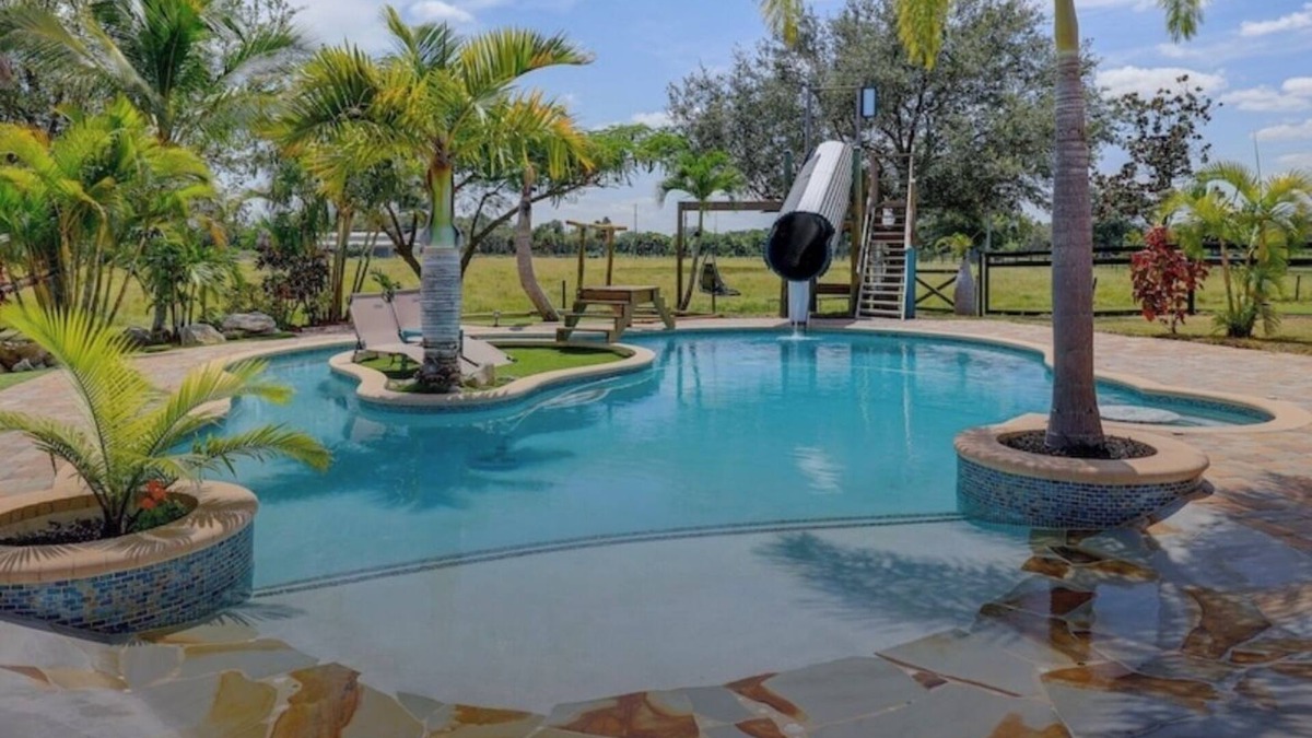 White City House | Private Tropical Oasis 4/2 Home with Resort Style Pool & Waterslide