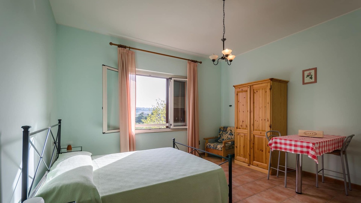 Pineto Apartment | Quiet apartment with swimming pool surrounded by hills 1 km from the sea