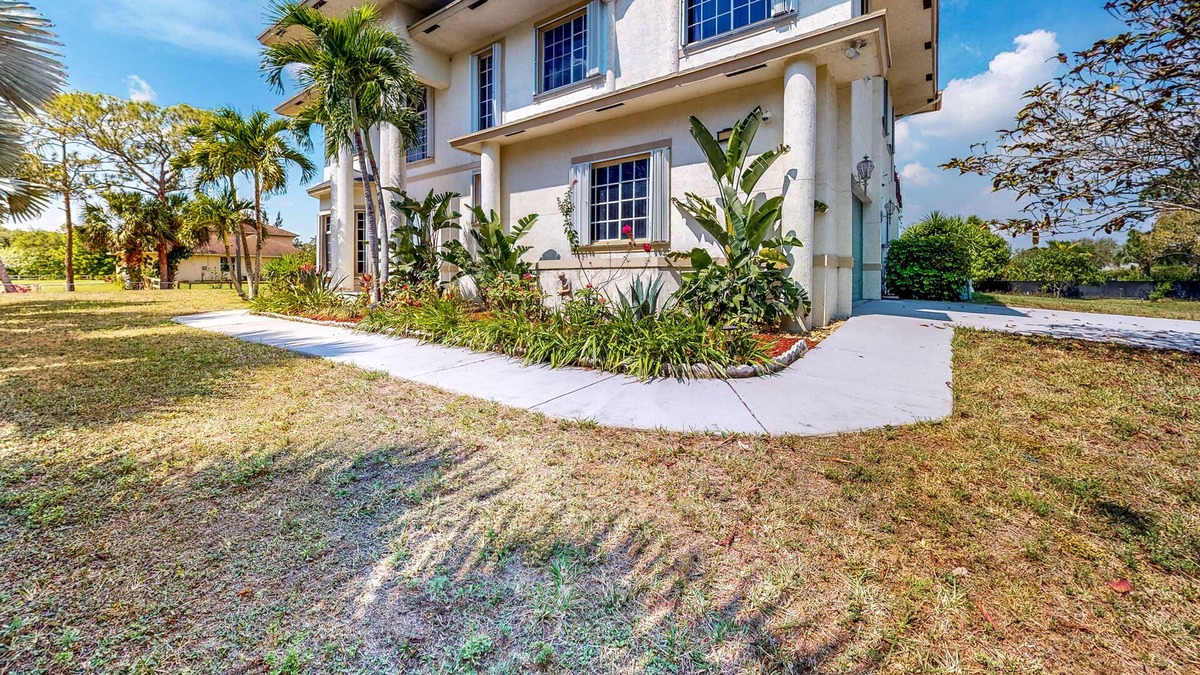 Loxahatchee House | Renovated, elegant retreat with a fitness room, work desks, large deck, & W/D