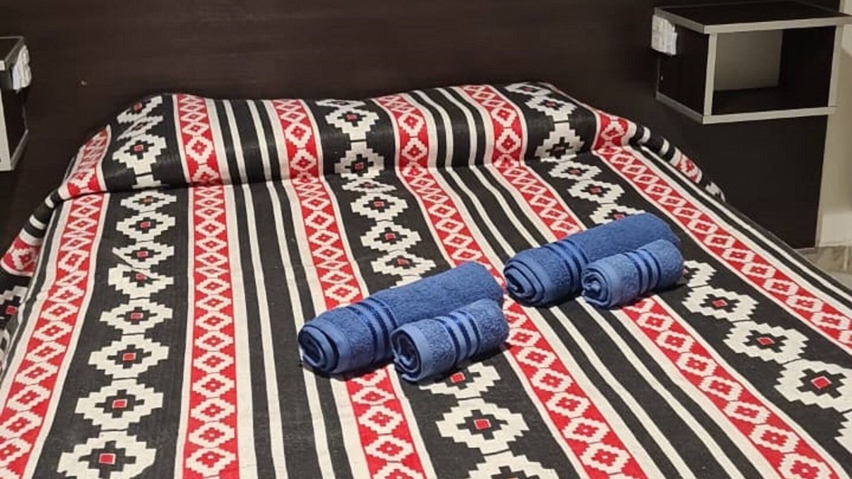 Province of Tierra del Fuego Apartment | Retreat to this haven along Route 3, with a sunlit ambiance and garden view.