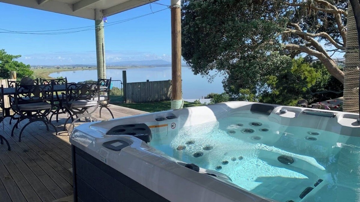 Te Kopuru House | Riverfront Family Home, with spa and stage