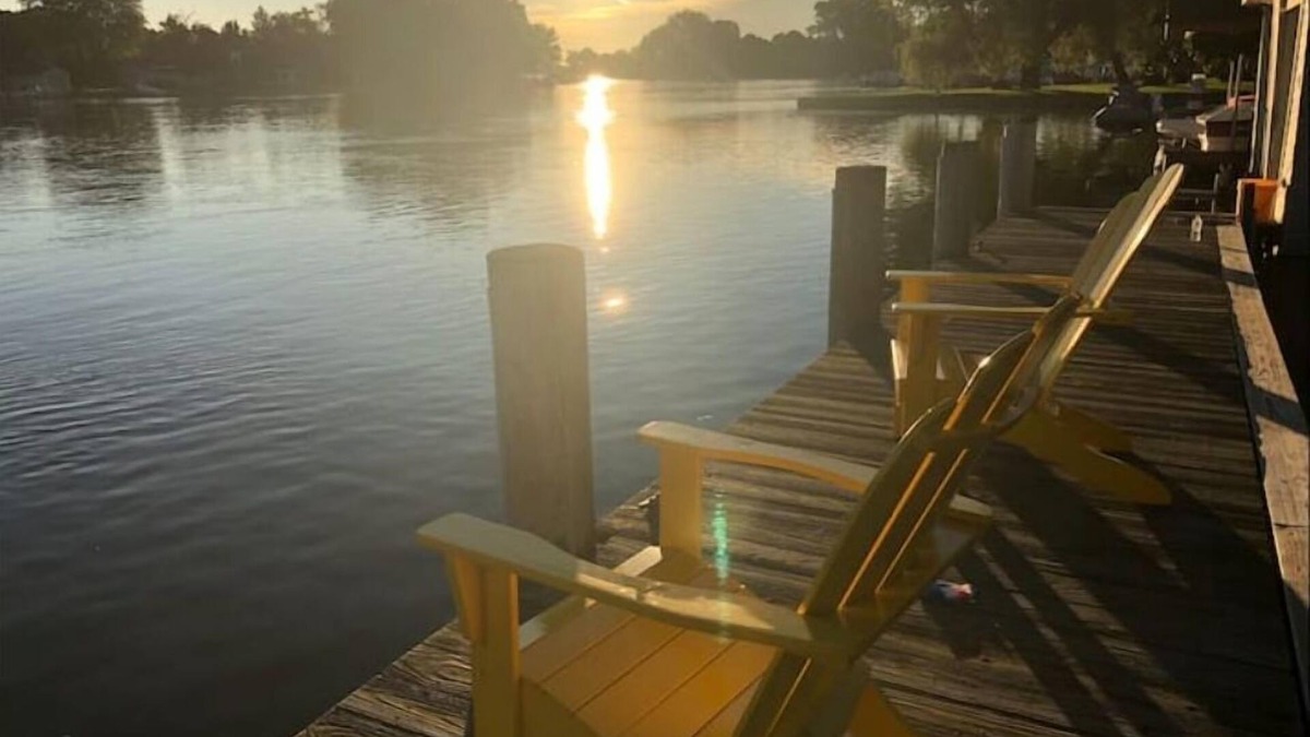 Menasha House | Riverfront Oasis - Hot tub- Seasonal heated pool