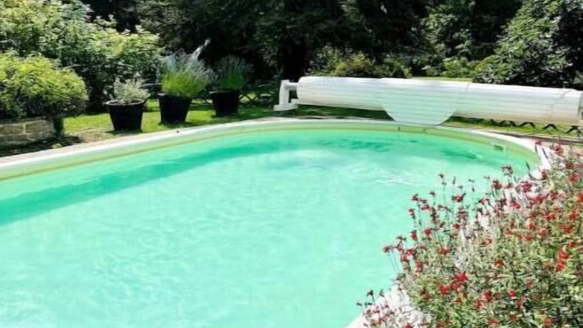Aulnay-la-Riviere House | Riverfront pool and sauna house in a flower-filled park