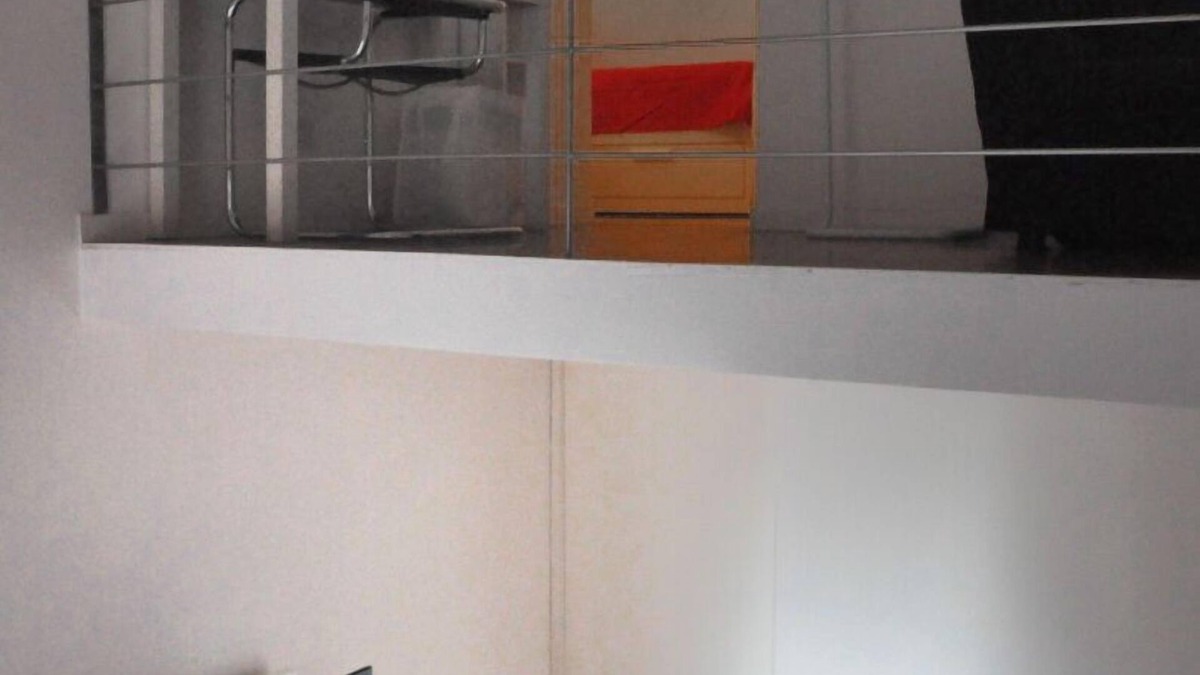 Rione XVIII Castro Pretorio Apartment | Rome: Sleeping space and living room - two levels between Repubbli
