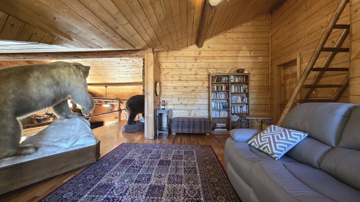 Buckinghorse River Cabin | Room 2 at the Main Lodge with a queen bed and single bed.