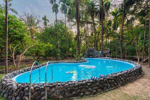 Tarapur Villa | SaffronStays Chikoo Wadi- 3BDR Pet-friendly Villa with Pool in Boisar