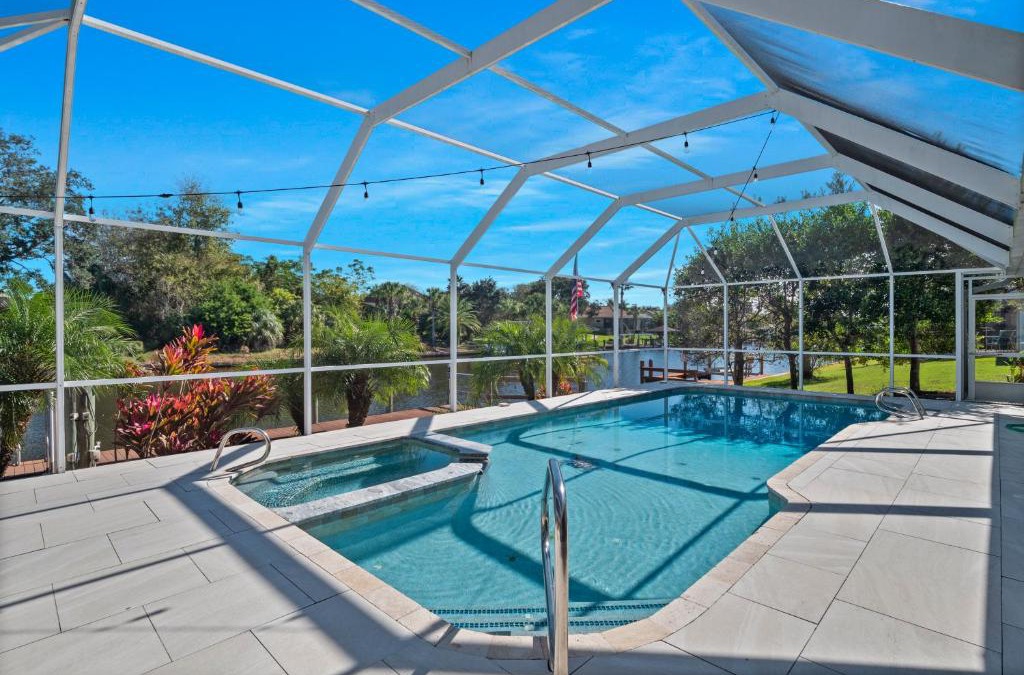 Palm Harbor House | SALTY TURTLE Luxury Salt Water Pool Home on Salt Water Canal with Tiki Bar