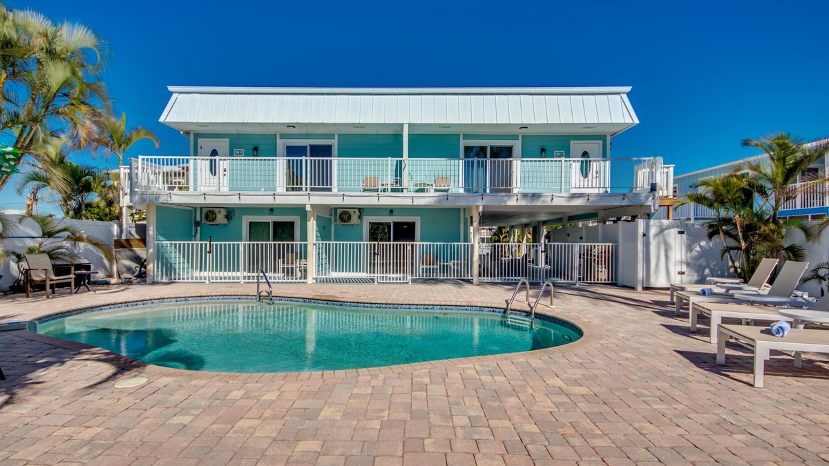 South Island House | Sand Dollar #1 - Downstairs Apt with Shared Pool on Canal by the Beach!