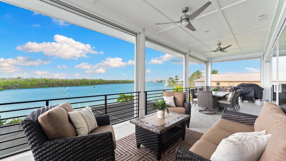 Bonita Springs House | Seafoam Serenity - Bayfront Retreat w/Dock, Pool & 1 Min Walk to Bonita Beach