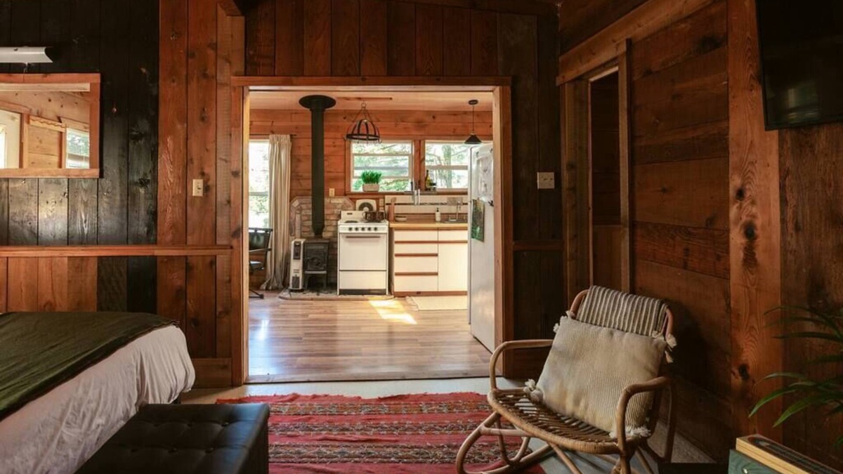 Lakeside Cabin | Secluded 1-bedroom lakefront cabin in Lakeside, OR. Ideal for writers or couples seeking solitude. Features a King bed, wood stove, kayak for 2, and stargazing from your private dock.