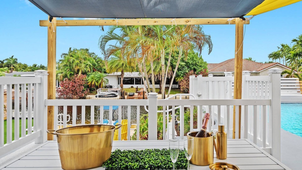 Lauderdale Isles House | Secluded Canal Sanctuary: Private Beach, Boat Dock, Pool, Mini-Golf Extravaganza